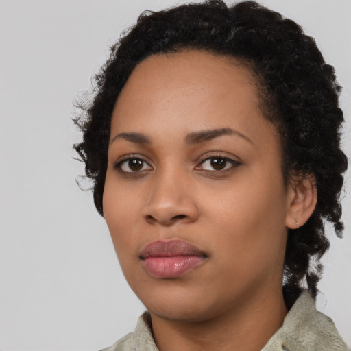 Neutral black young-adult female with short  black hair and brown eyes