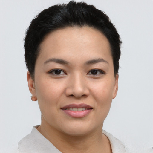 Joyful white young-adult female with short  black hair and brown eyes
