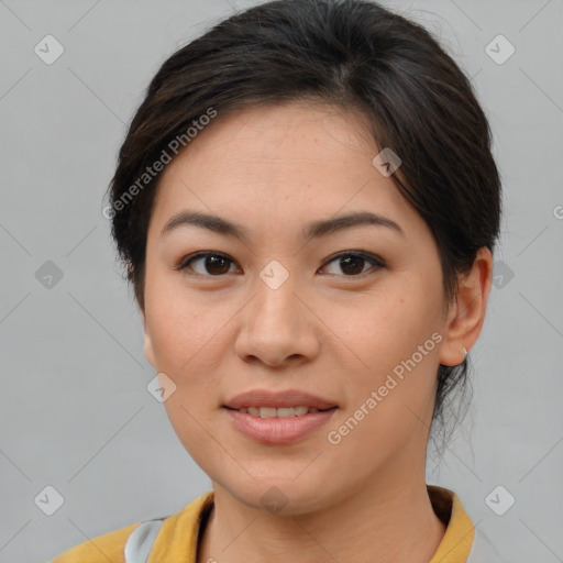 Joyful asian young-adult female with short  brown hair and brown eyes