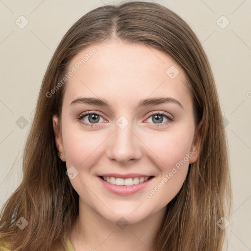 Joyful white young-adult female with long  brown hair and green eyes