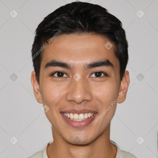 Joyful white young-adult male with short  black hair and brown eyes