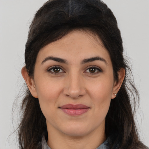 Joyful white young-adult female with long  brown hair and brown eyes