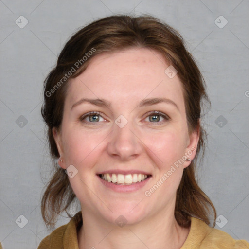 Joyful white young-adult female with medium  brown hair and blue eyes