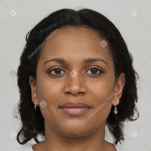 Joyful black young-adult female with medium  brown hair and brown eyes