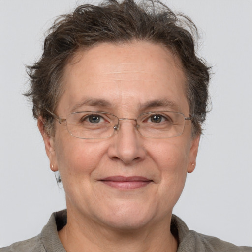 Joyful white middle-aged female with short  brown hair and brown eyes