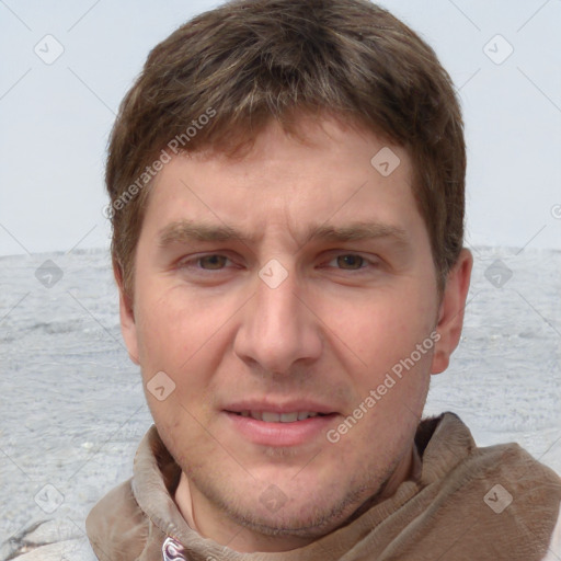 Joyful white adult male with short  brown hair and grey eyes