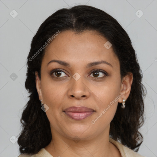 Joyful latino young-adult female with medium  brown hair and brown eyes