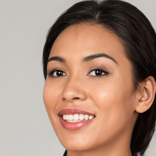 Joyful white young-adult female with medium  brown hair and brown eyes