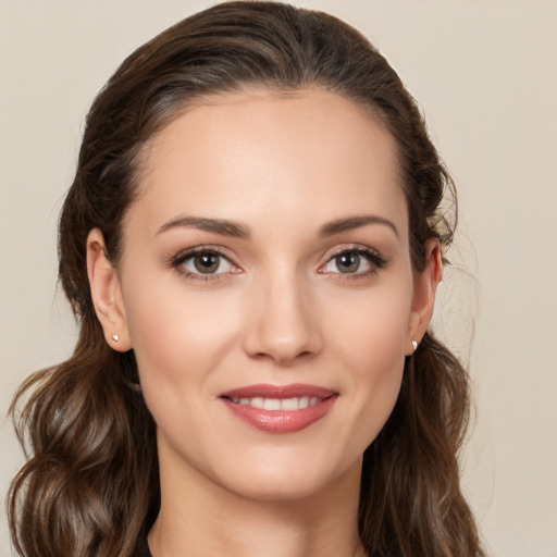 Joyful white young-adult female with medium  brown hair and brown eyes