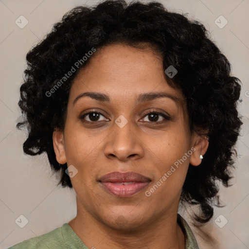 Joyful black adult female with short  brown hair and brown eyes