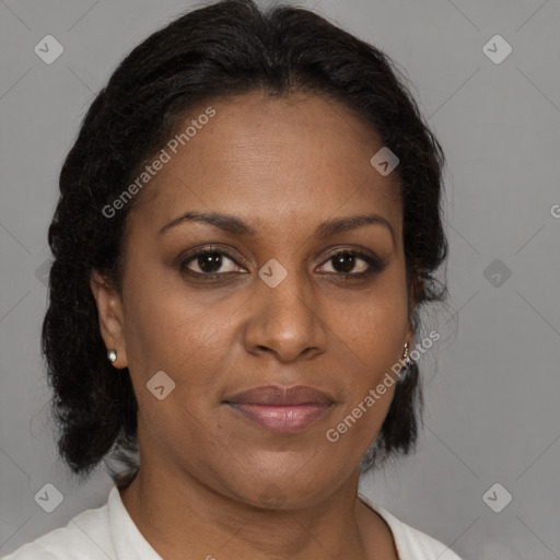 Joyful black adult female with medium  brown hair and brown eyes