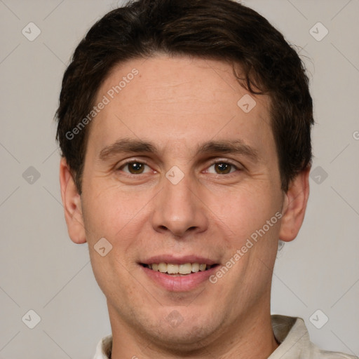 Joyful white adult male with short  brown hair and grey eyes