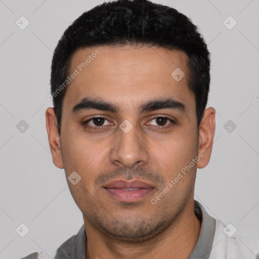 Neutral latino young-adult male with short  black hair and brown eyes