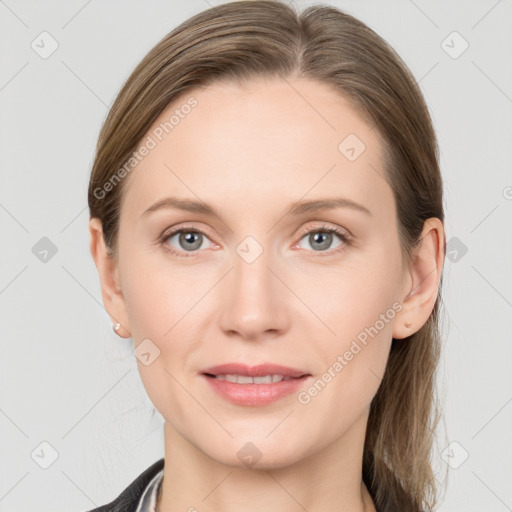 Joyful white young-adult female with long  brown hair and grey eyes