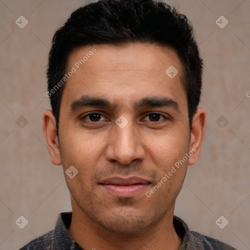 Joyful white young-adult male with short  black hair and brown eyes