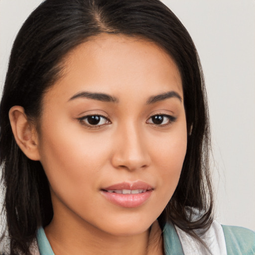 Joyful latino young-adult female with long  brown hair and brown eyes