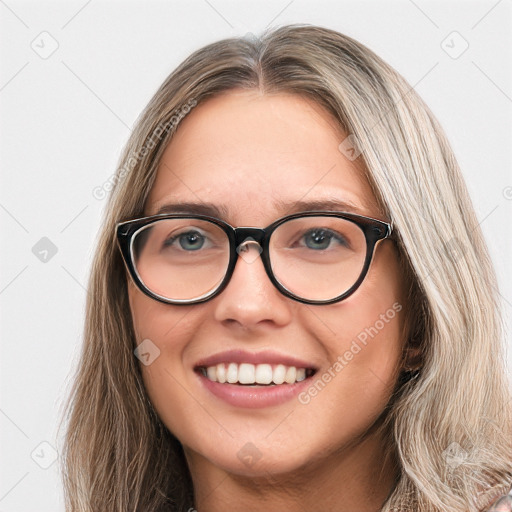 Joyful white young-adult female with long  brown hair and blue eyes