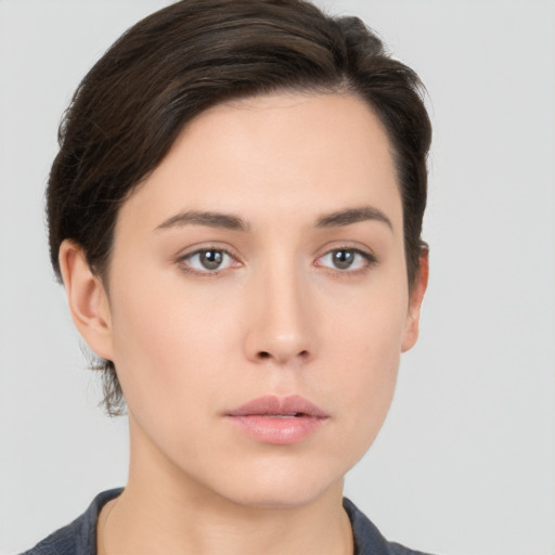 Neutral white young-adult female with short  brown hair and brown eyes