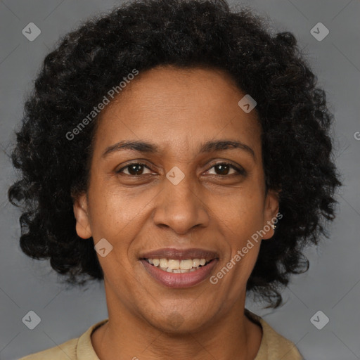 Joyful latino adult female with short  brown hair and brown eyes