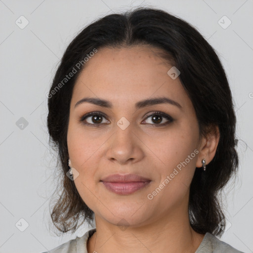 Joyful latino young-adult female with medium  brown hair and brown eyes