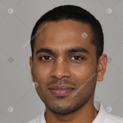 Joyful black young-adult male with short  black hair and brown eyes