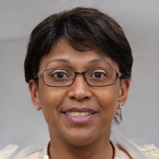 Joyful white adult female with short  brown hair and brown eyes