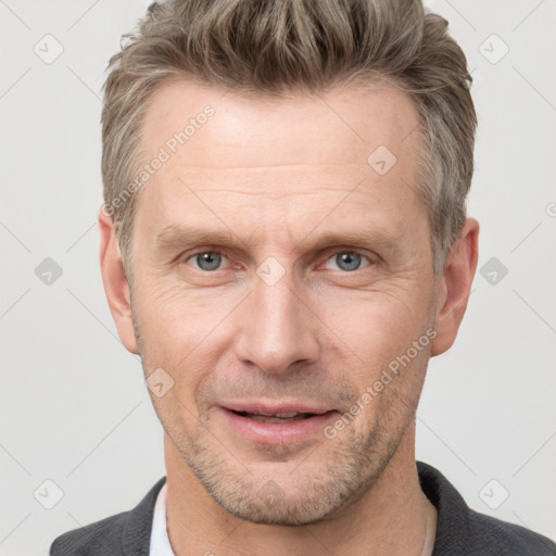 Joyful white adult male with short  brown hair and grey eyes