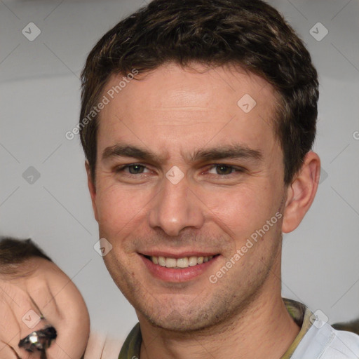 Joyful white adult male with short  brown hair and brown eyes