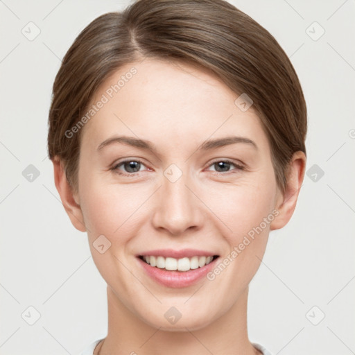 Joyful white young-adult female with short  brown hair and grey eyes