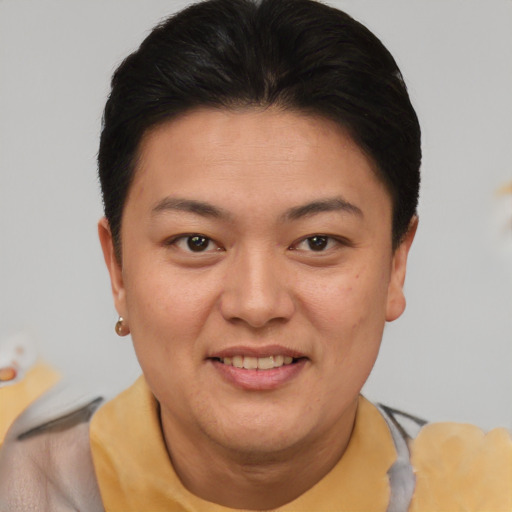 Joyful asian young-adult female with short  brown hair and brown eyes