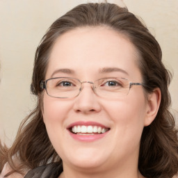 Joyful white young-adult female with medium  brown hair and blue eyes