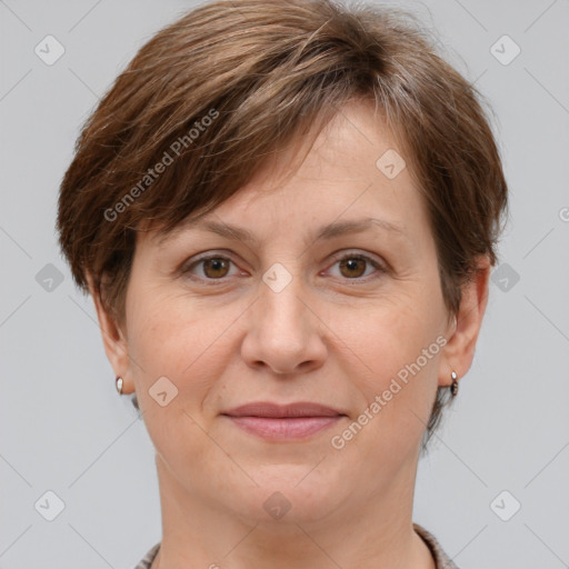 Joyful white adult female with short  brown hair and grey eyes