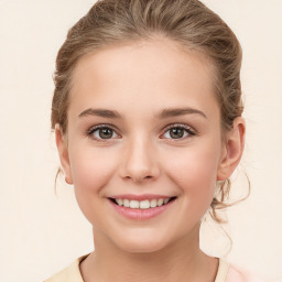 Joyful white child female with medium  brown hair and brown eyes