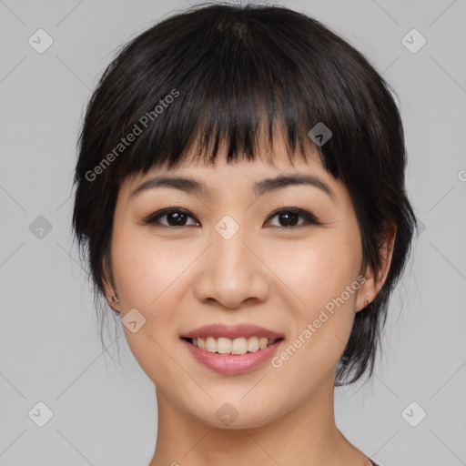 Joyful asian young-adult female with medium  black hair and brown eyes