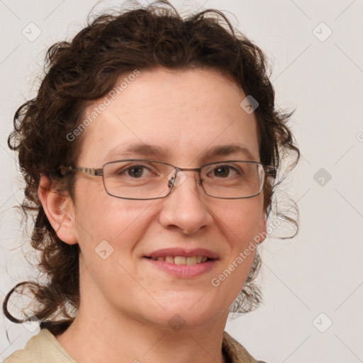 Joyful white adult female with medium  brown hair and blue eyes