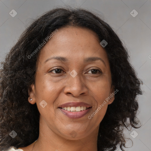 Joyful black adult female with medium  brown hair and brown eyes