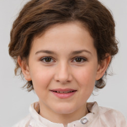 Joyful white child female with short  brown hair and brown eyes