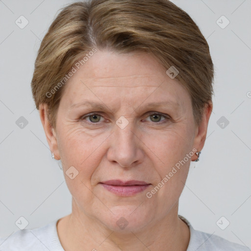 Joyful white adult female with short  brown hair and grey eyes