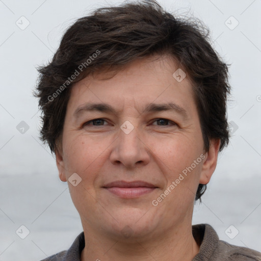 Joyful white adult female with short  brown hair and brown eyes