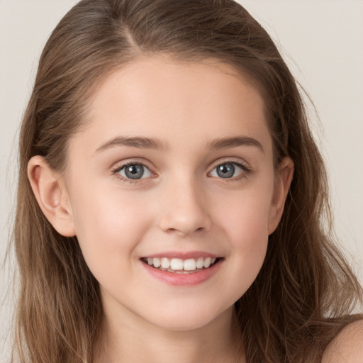 Joyful white child female with long  brown hair and grey eyes