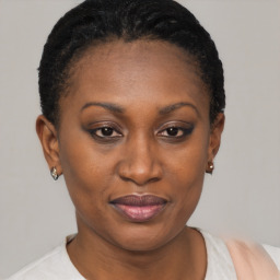 Joyful black young-adult female with short  brown hair and brown eyes