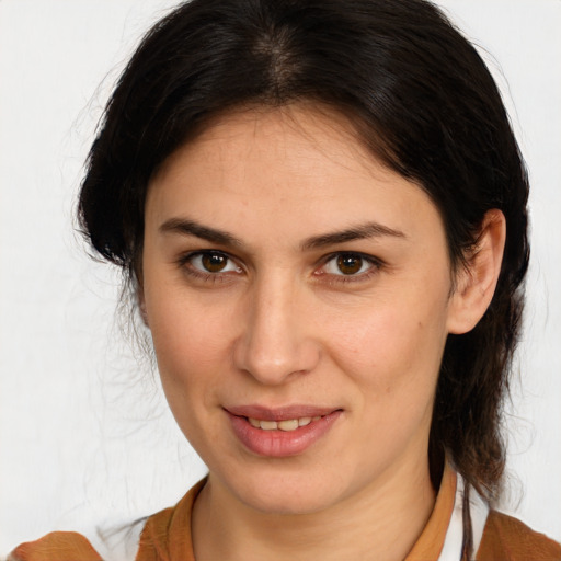 Joyful white young-adult female with medium  brown hair and brown eyes