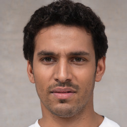 Neutral white young-adult male with short  black hair and brown eyes