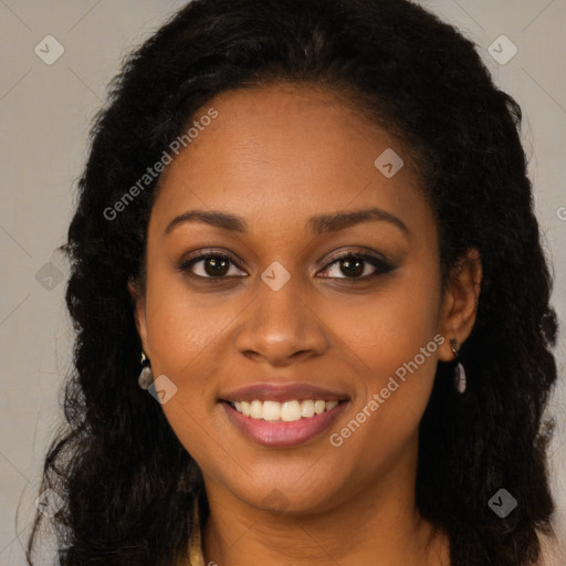 Joyful black young-adult female with long  brown hair and brown eyes