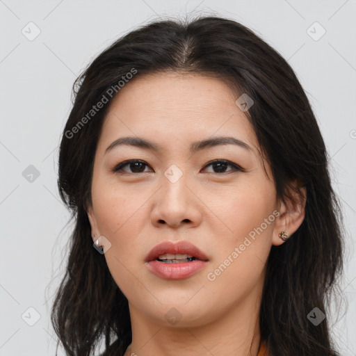 Joyful asian young-adult female with long  brown hair and brown eyes