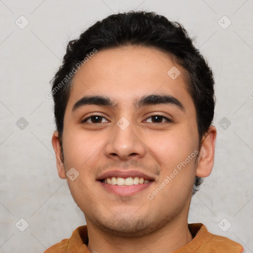 Joyful white young-adult male with short  black hair and brown eyes