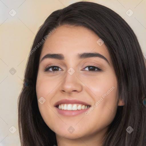 Joyful white young-adult female with long  black hair and brown eyes