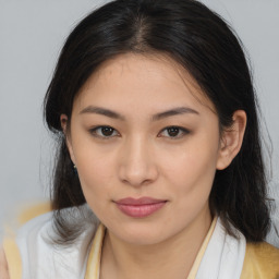 Joyful asian young-adult female with long  brown hair and brown eyes