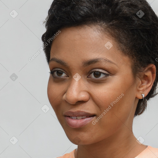 Joyful black young-adult female with short  brown hair and brown eyes