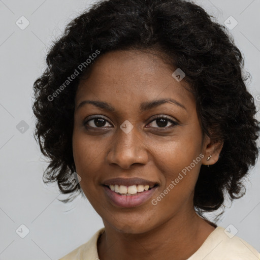 Joyful black young-adult female with long  brown hair and brown eyes